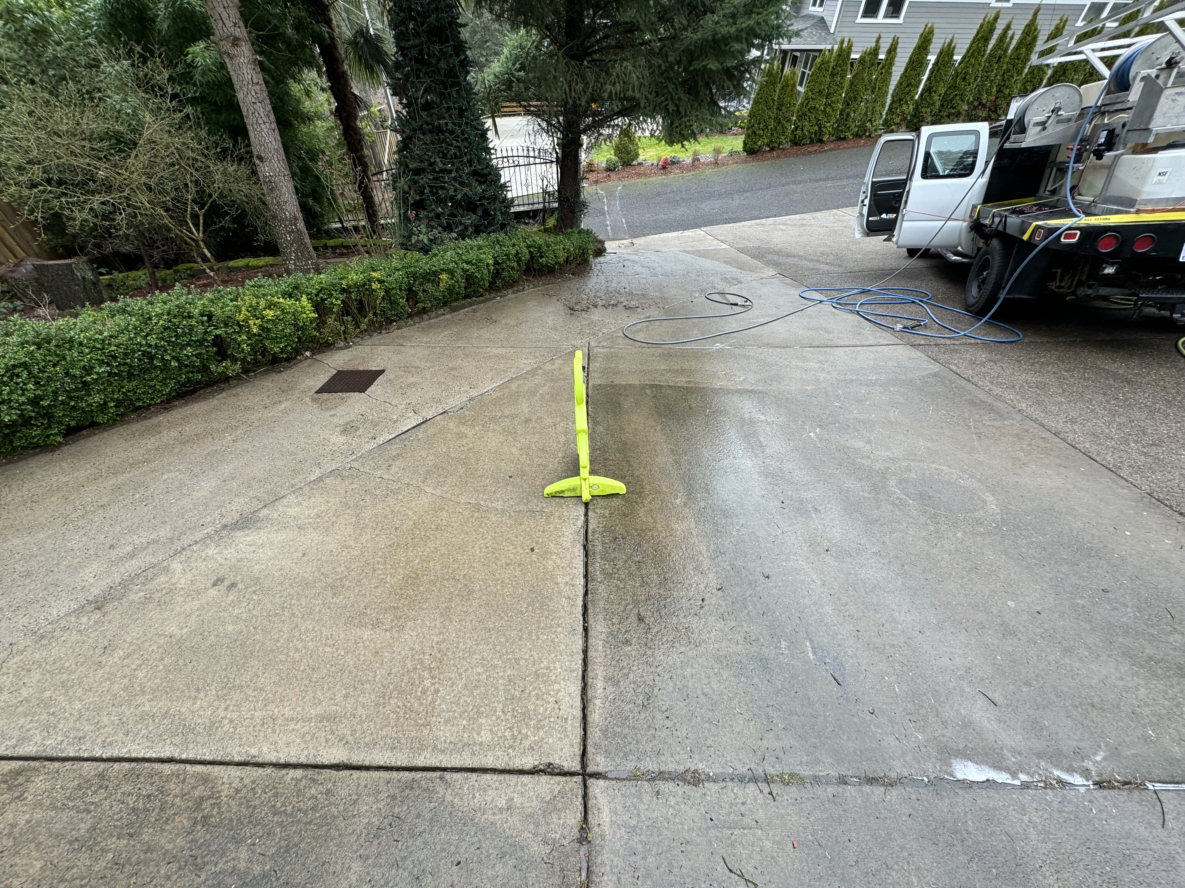 Driveway pressure washing with Bear Property truck