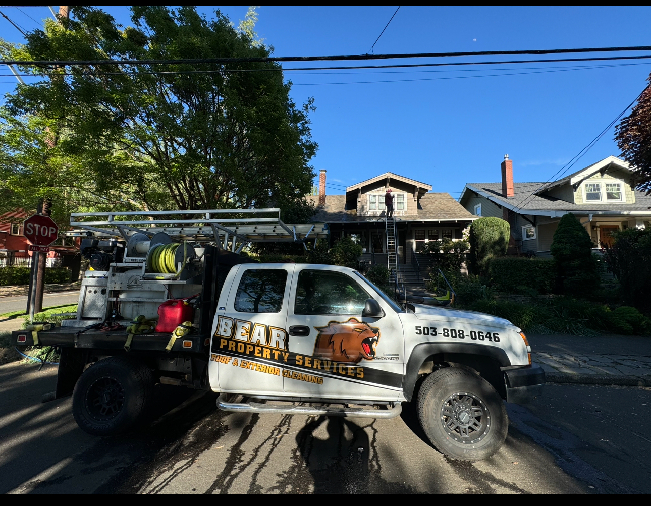 Professional exterior cleaning crew member on job site